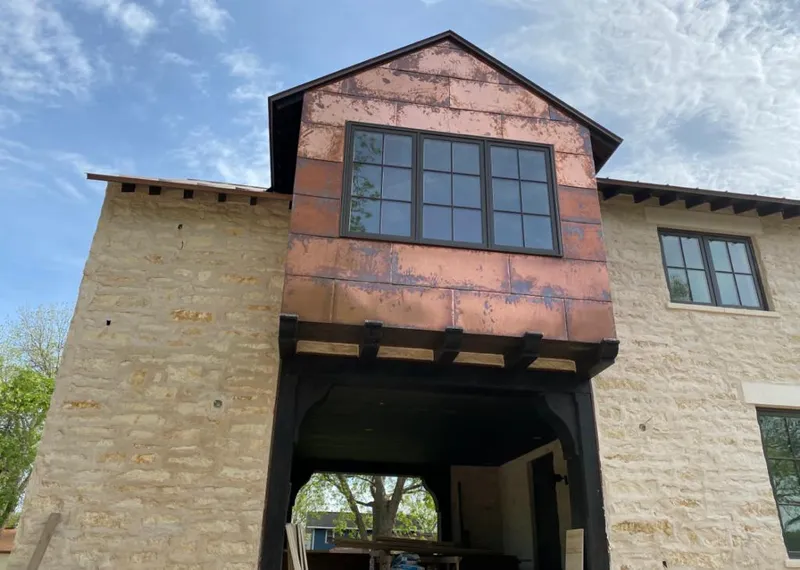 Copper metal panel facade on a stone building for Skylight Installation in Cuyahoga Falls